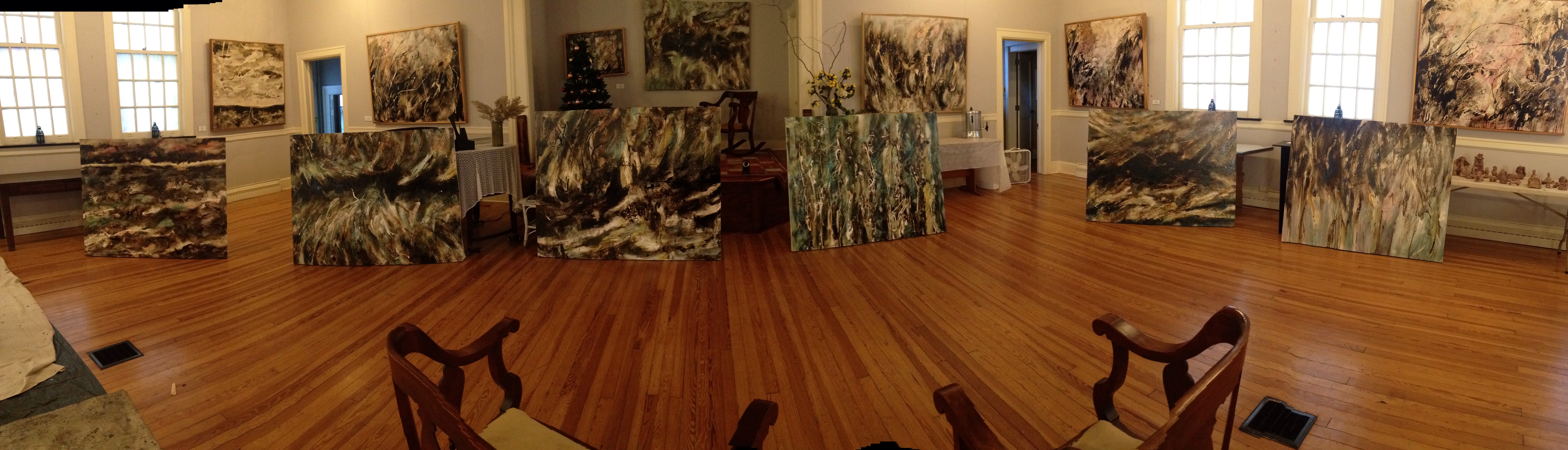 Panoramic gallery room with large abstract paintings