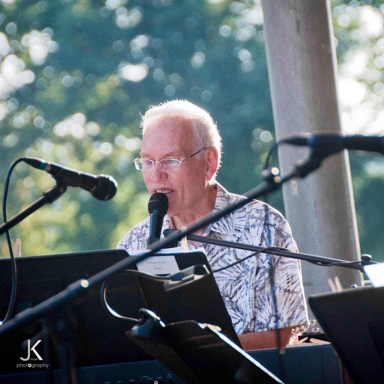 Man singing at outdoor keyboard performance