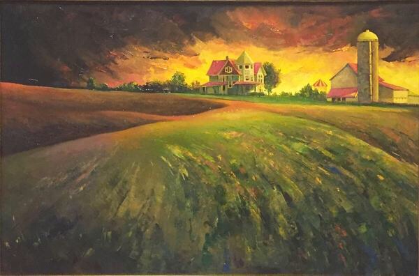 Sunset farmhouse and silo over rolling fields