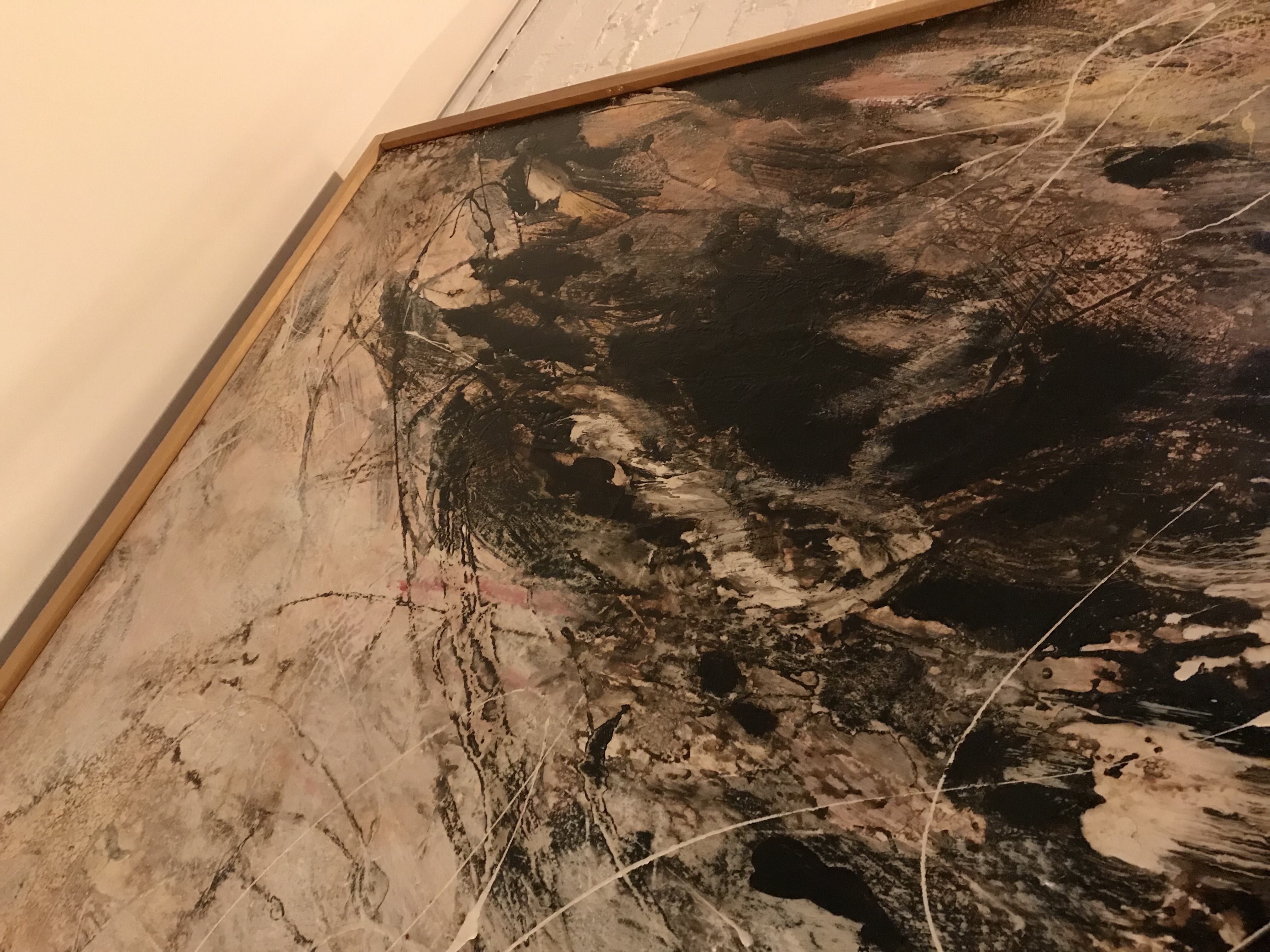 Large abstract canvas with dark swirling textures